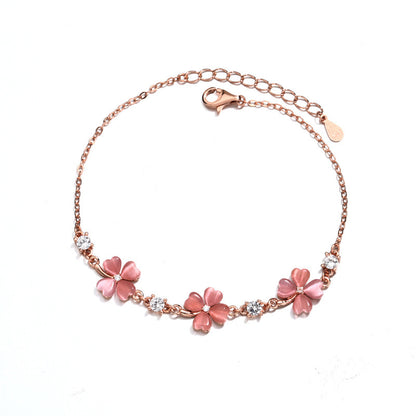 Bracelet en or rose avec pierres précieuses et cristaux